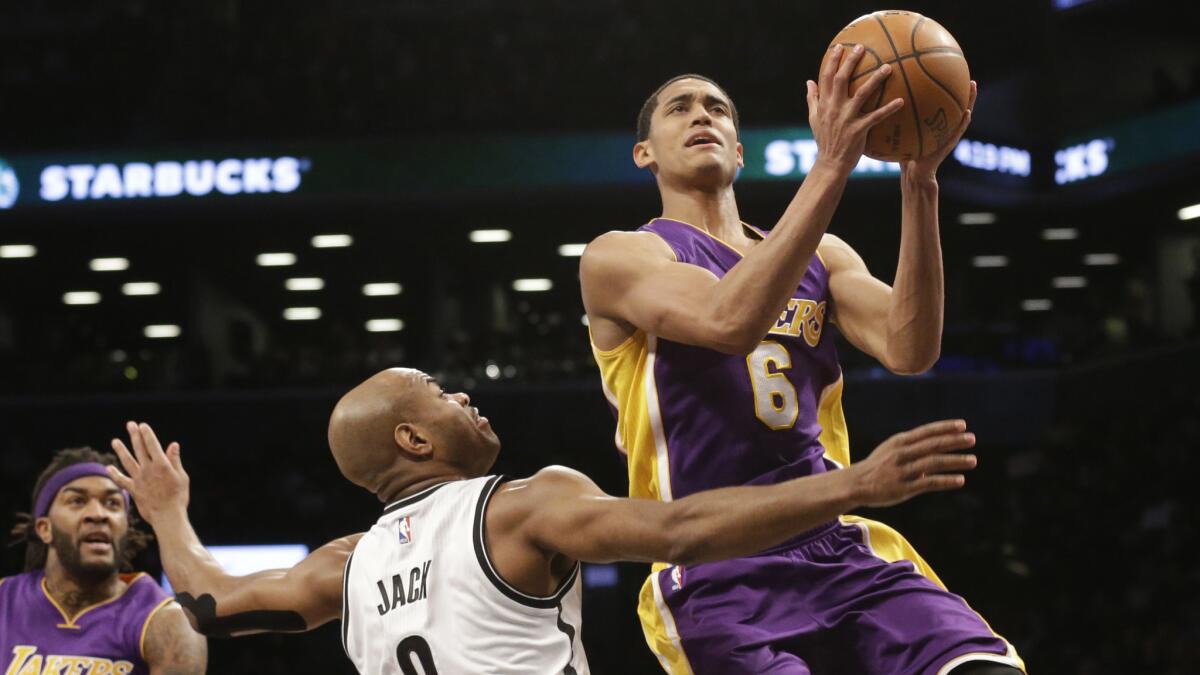 Lakers guard Jordan Clarkson, right, puts up a shot over Brooklyn Nets guard Jarrett Jack during the first half of a game on March 29, 2015.