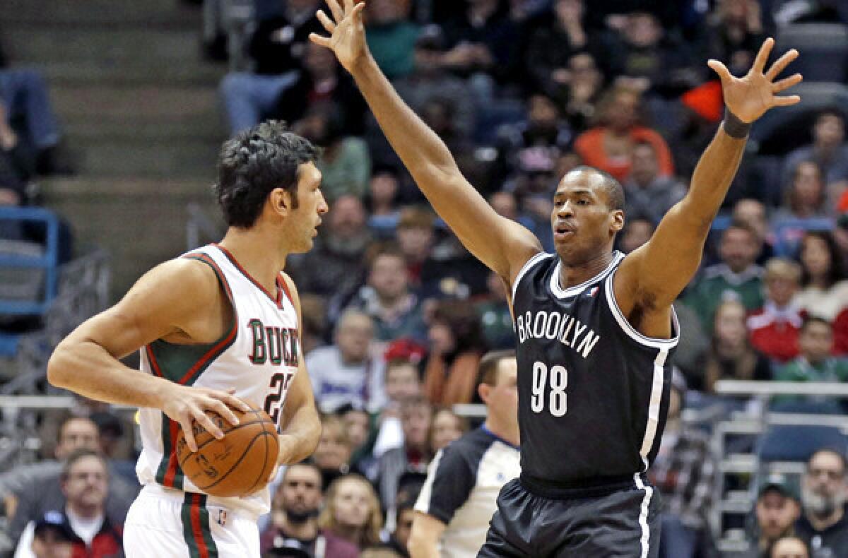 Nets center Jason Collins (98) defends against bucks center ZaZa Pachulia during a game last week in Milwaukee.