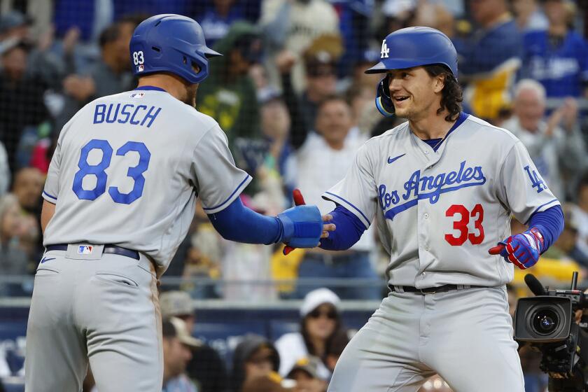 San Diego, CA - May 6: Los Angeles Dodgers' James Outman celebrates a two-run home run with Michael Busch.