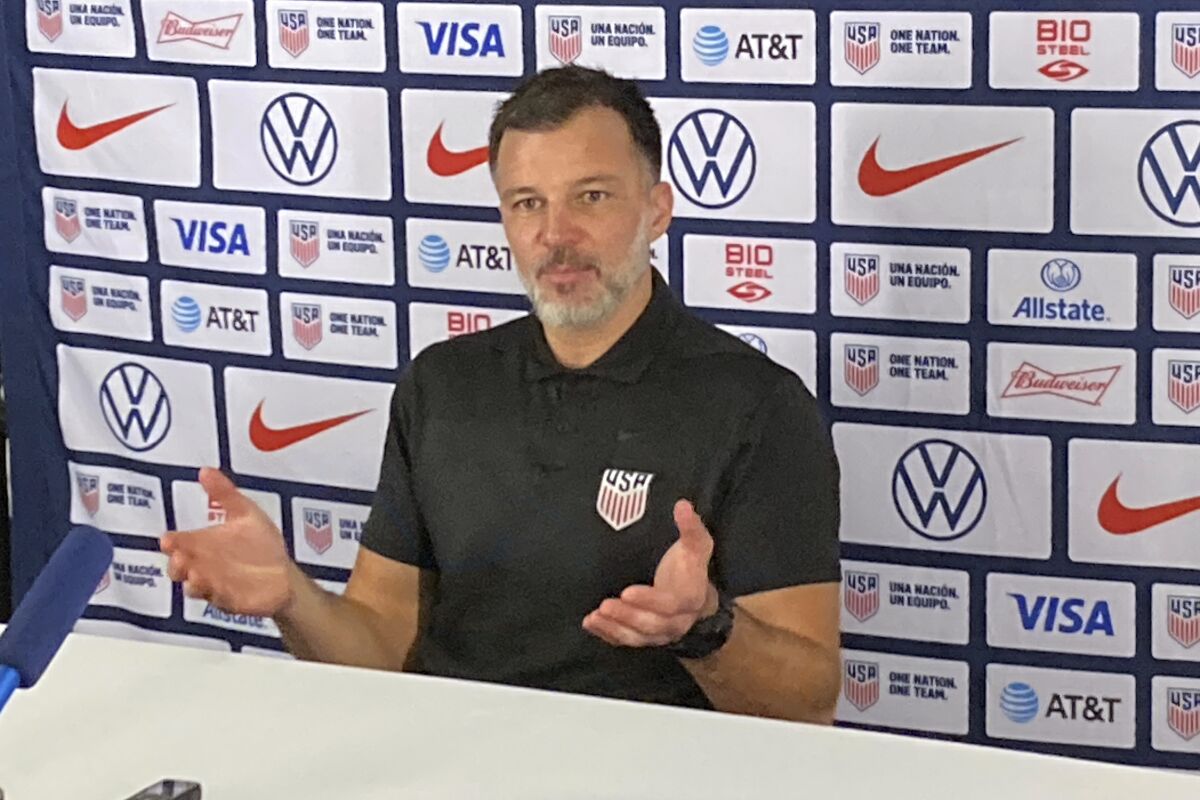 Anthony Hudson speaks to reporters during a news conference Saturday.