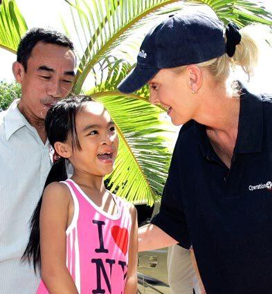 Cindy McCain, wife of Arizona Sen. John McCain, the presumptive Republican presidential candidate, meets with Phuoc Thi Le, 11, during a visit to an Operation Smile mission in Nha Trang,Vietnam, earlier this month. In 1997, the McCains arranged for Le, who was born with a facial deformity, to be brought to the U.S. for surgery. Le's father, Le Van Tan, looks on at their reunion.