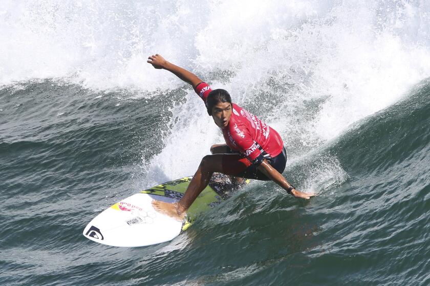 Huntington Beach's Kanoa Igarashi rides a wave during the U.S. Open of Surfing at Huntington Beach on Wednesday.