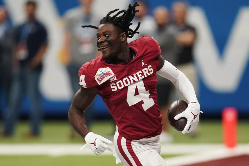 Oklahoma wide receiver Mario Williams (4) after losing his helmet on a play during the first half of the Alamo Bowl NCAA college football game against Oregon, Wednesday, Dec. 29, 2021, in San Antonio. (AP Photo/Eric Gay)