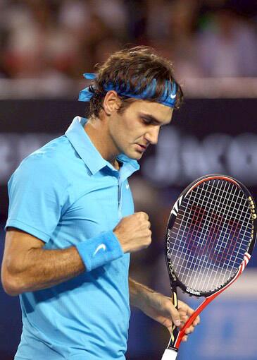 Roger Federer pumps his first afer winning a point against Andy Murray in the Australian Open men's final on Sunday.
