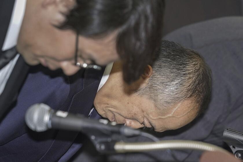 Akihiro Kobayashi, president of Kobayashi Pharmaceutical Co., bows in apology at a news conference in Osaka, western Japan, Friday, March 29, 2024. In the week since a line of Japanese health supplements began being recalled, several people have died and more than 100 people were hospitalized as of Friday. The Osaka-based pharmaceutical company came under fire for not going public quickly with problems known internally as early as January. The first public announcement came March 22. (Kyodo News via AP)