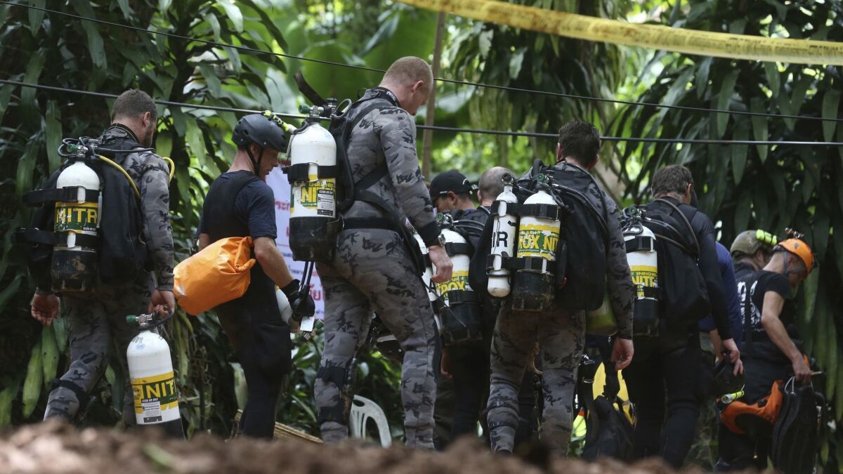 An international rescue team prepares to enter the cave where a young soccer team and their coach remain trapped.
