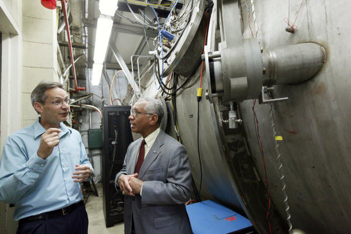 NASA Administrator Charles Bolden, right, talks with electric propulsion engineer John Brophy during a visit to NASA's Jet Propulsion Laboratory.