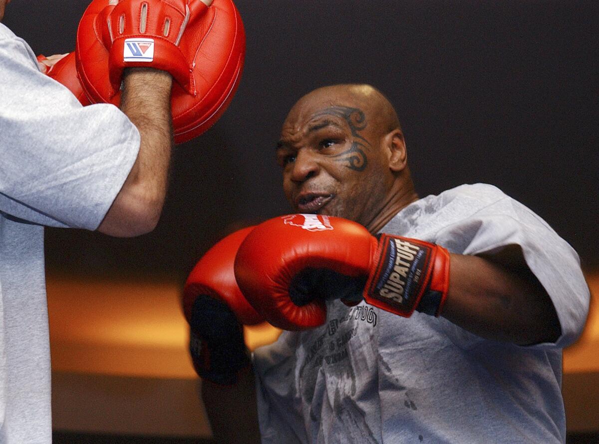 Former heavyweight boing champion Mike Tyson spars during a 2006 training exhibition in Las Vegas. 