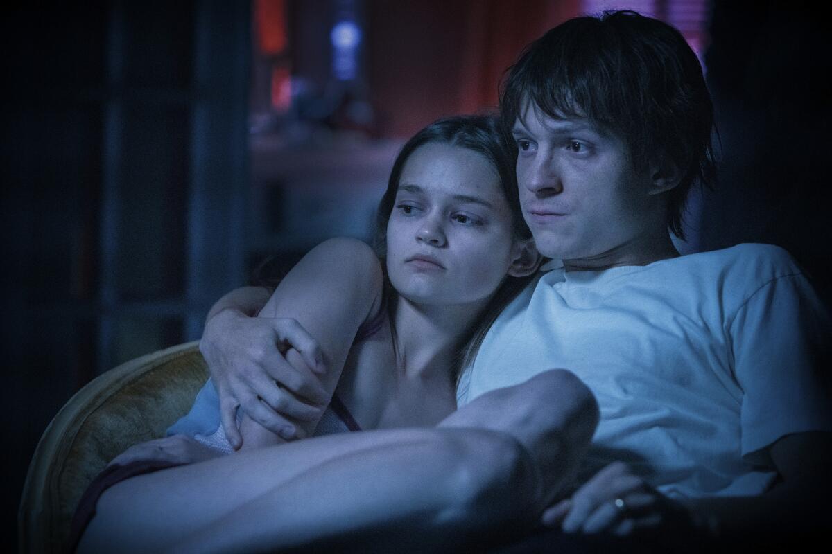 Ciara Bravo and Tom Holland in the movie "Cherry."