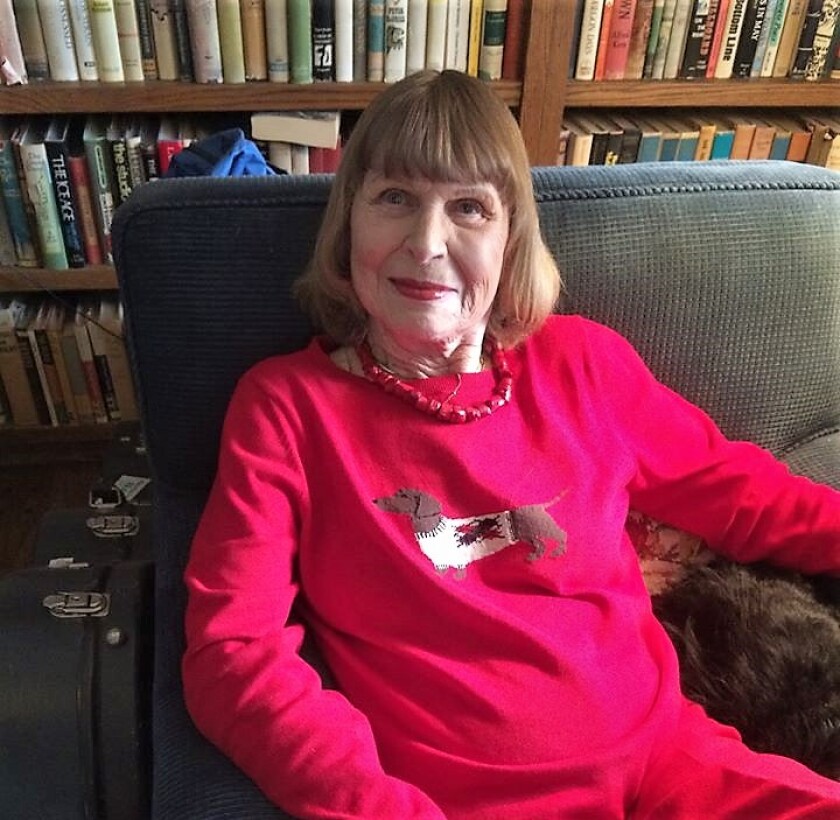 Betty Bennett in pink outfit on sofa.jpg