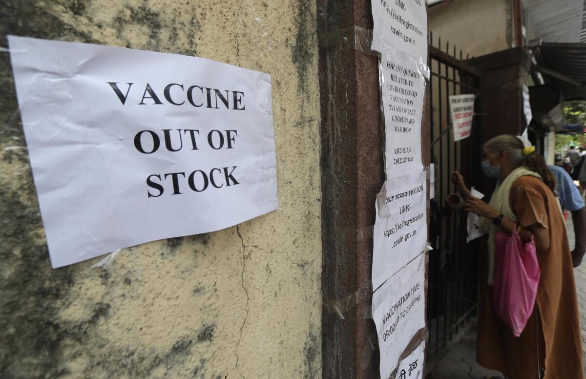 A note informing about the COVID-19 vaccine is seen pasted on a wall of a vaccination centre in Mumbai, India, Thursday, April 8, 2021. India's western Maharashtra state, home to financial capital Mumbai, is the worst-hit and has nearly half of the country new infections in the past week. And now some vaccination centers are turning away people due to a shortage. The state said Wednesday that stocks would run out in three days, promoting an angry denial from India's health minister Harsh Vardhan, who blamed the state for “singularly bogging down the entire country's efforts to fight the virus.” (AP Photo/Rafiq Maqbool)