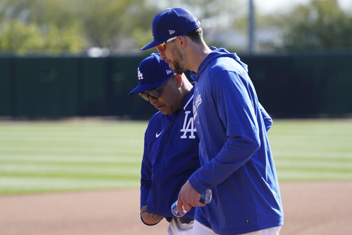 Dodgers outfielder Bradley Zimmer, right, talks with manager Dave Roberts at Camelback Ranch.