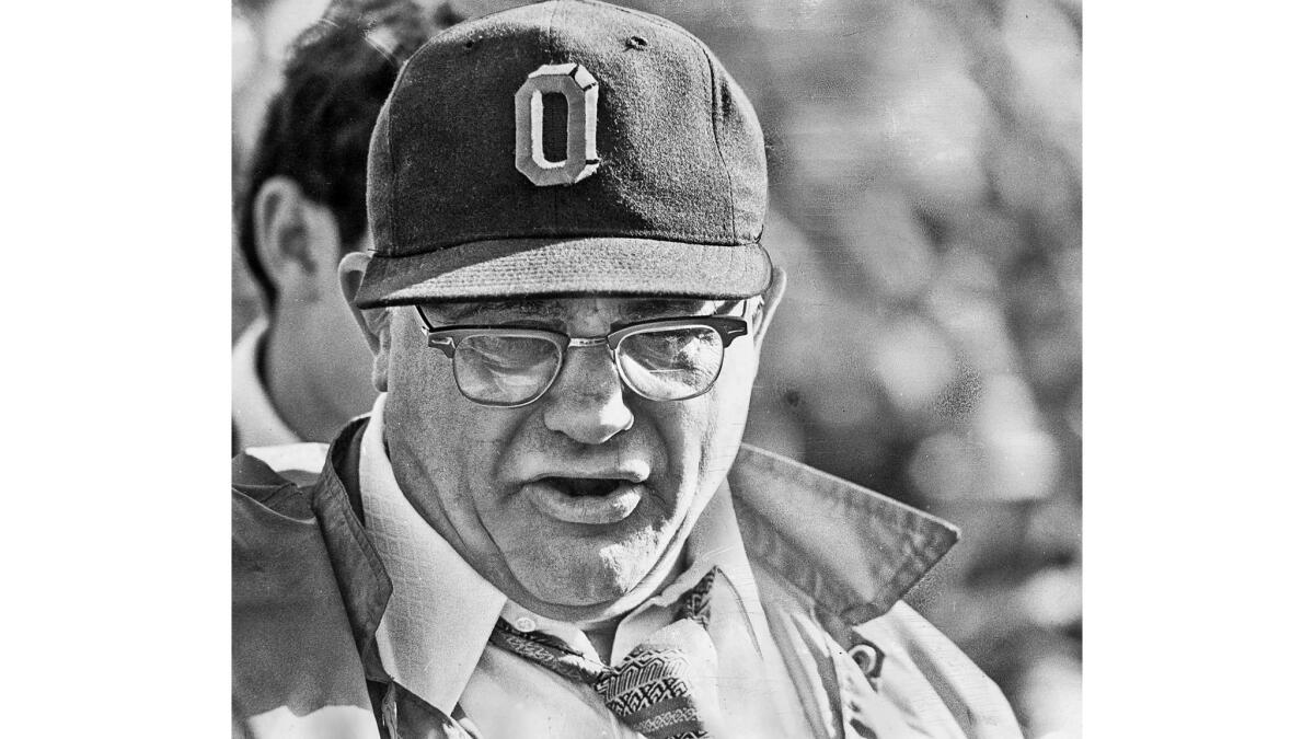 Jan. 1, 1973: Woody Hayes leaves a pregame huddle before the Rose Bowl game between USC and Ohio State. Right after this photo was taken, Hayes shoved photographer Art Rogers' camera into his face.