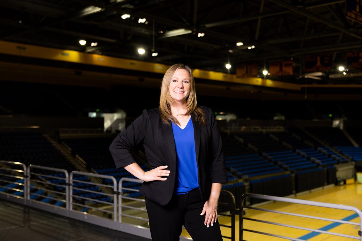 Janelle McDonald, UCLA's new gymnastics coach, poses for a photo in the gym.