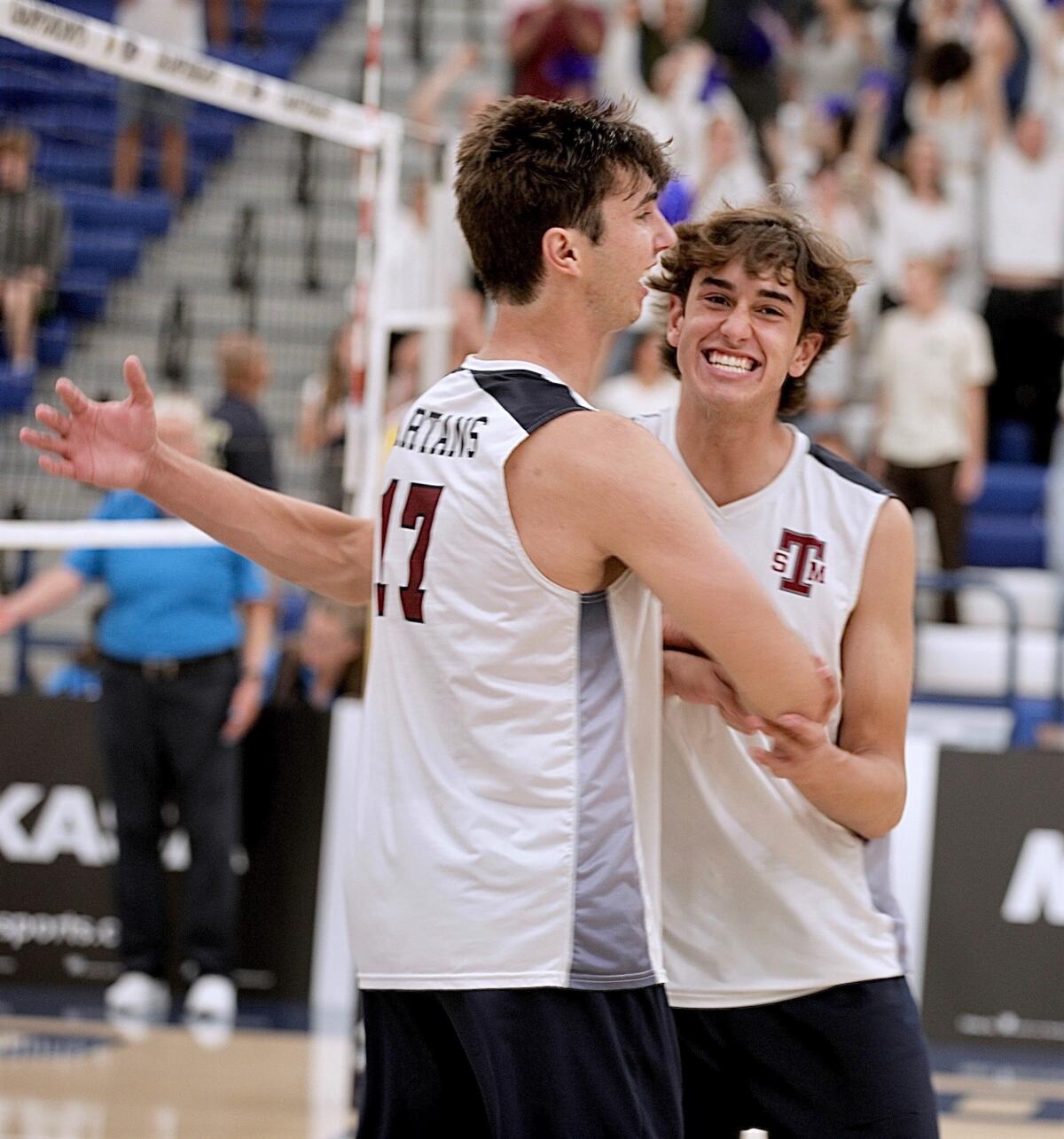 Reed Wainright (left) is congratulated by Miles Eaton after St. Margaret's beat San Clemente.
