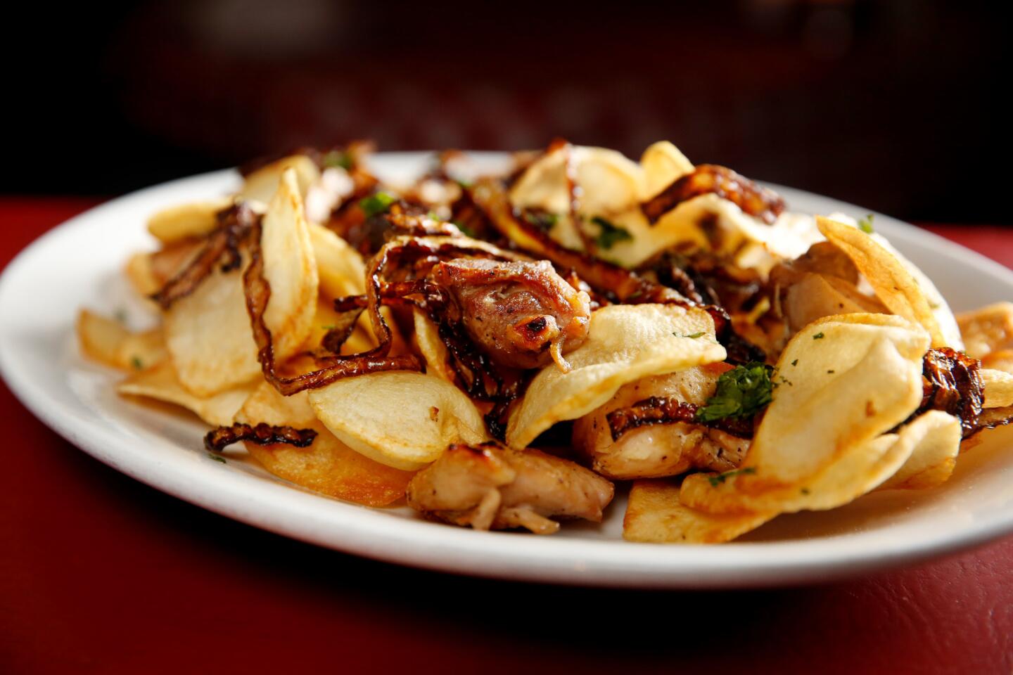 A lot of the dishes at Dan Tana's are named after people. The late Hollywood producer Sidney Beckerman's moniker is attached to this assemblage of freshly made potato chips, tender onions and garlic, as well as to a version in which all of this accompanies baked dark-meat chicken.