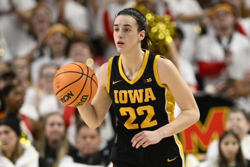Iowa guard Caitlin Clark controls the ball during a game against Maryland on Feb. 3.
