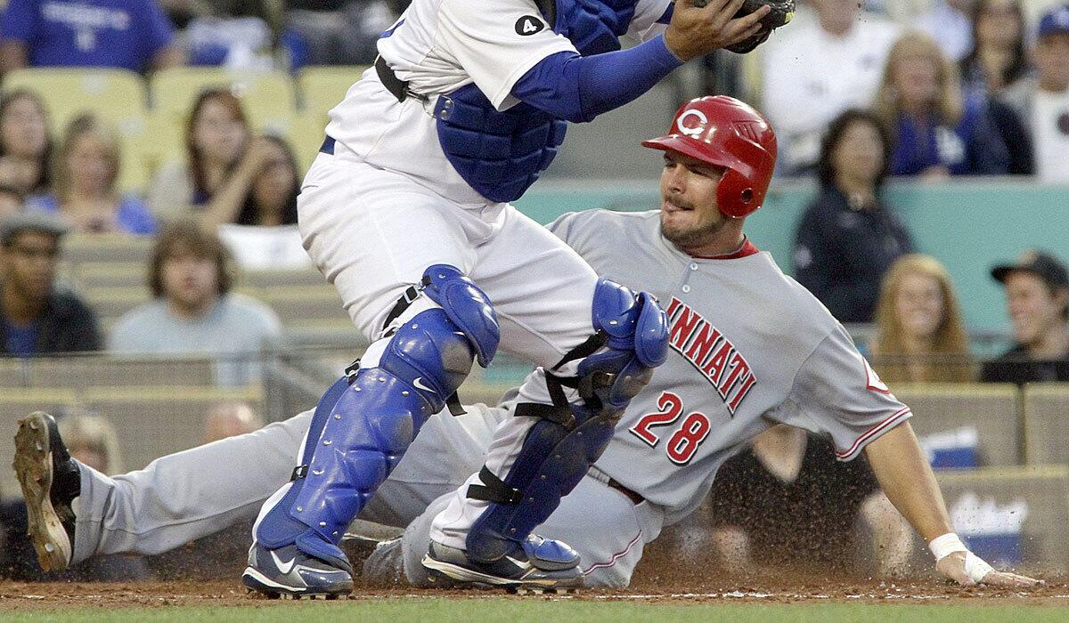 Chris Heisey scores for the Cincinnati Reds back in 2011.