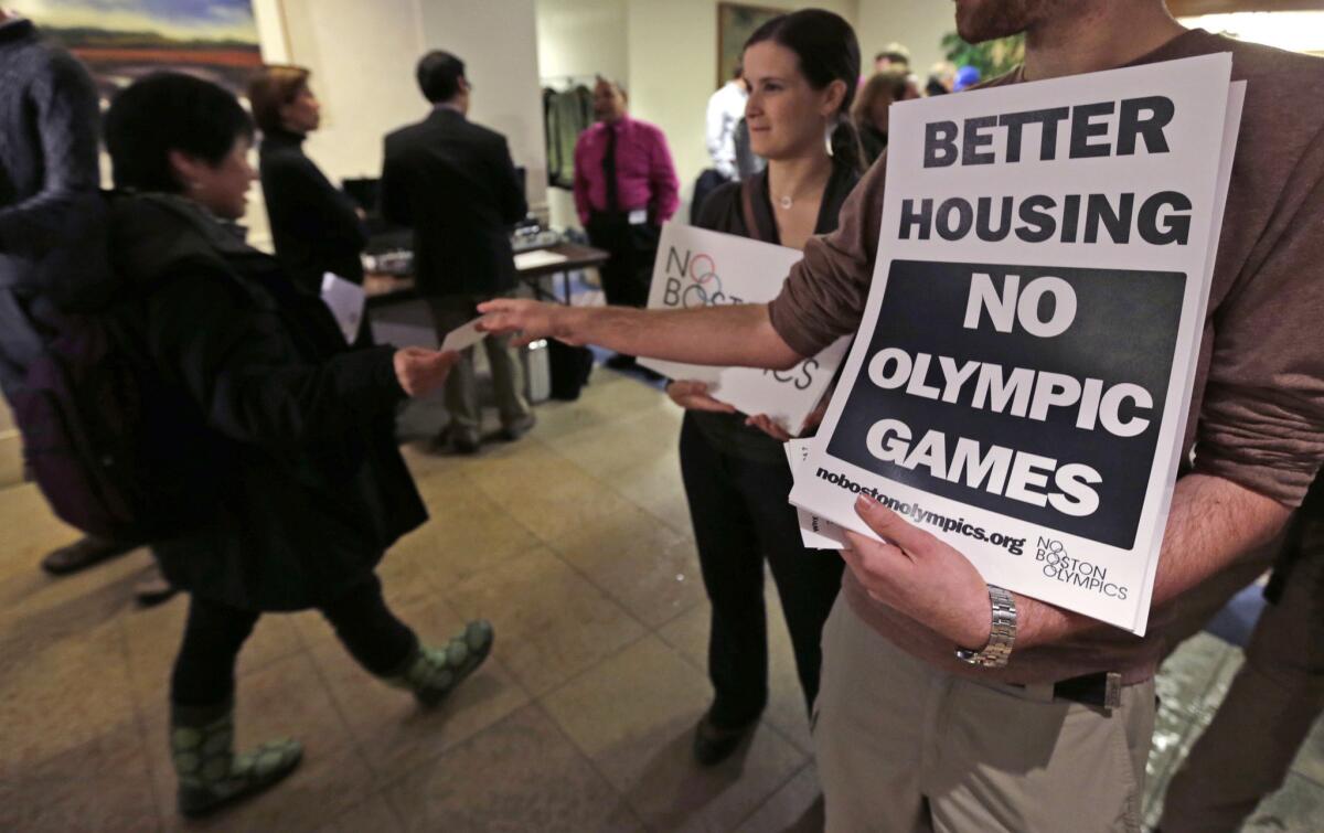 Jonathan Cohn and Claire Blechman hand out fliers prior to the first public forum regarding the Boston 2024 Olympic bid on Feb. 2.