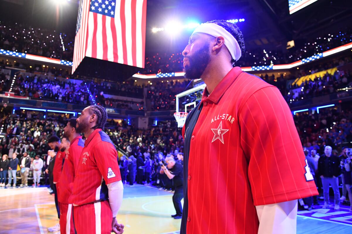 Lakers star Anthony Davis stands during the singing of the national anthem before Sunday's NBA All-Star Game in Indianapolis.