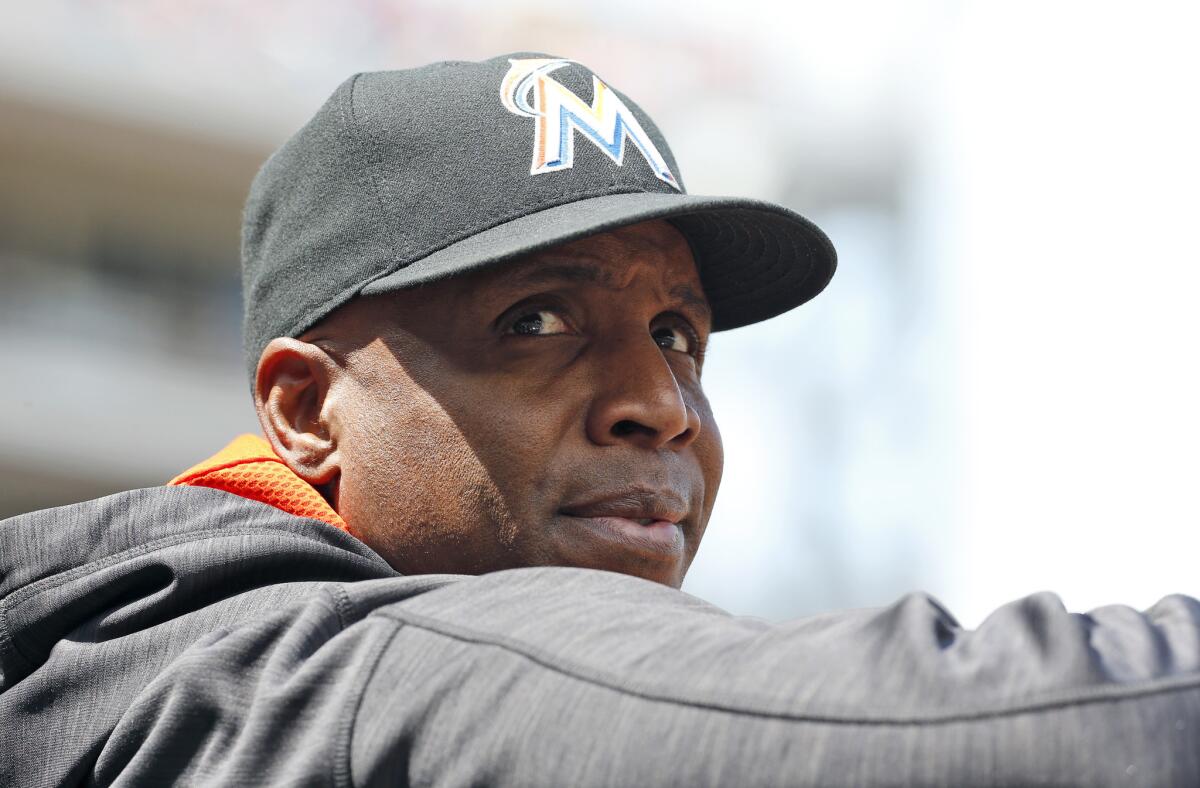 Miami hitting coach Barry Bonds stands in the dugout during a game against Washington on May 15.