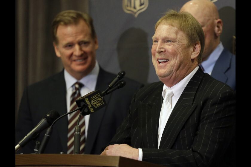 NFL Commissioner Roger Goodell, left, laughs as Oakland Raiders owner Mark Davis talks to reporters after the NFL owners meeting in Houston on Jan. 12.