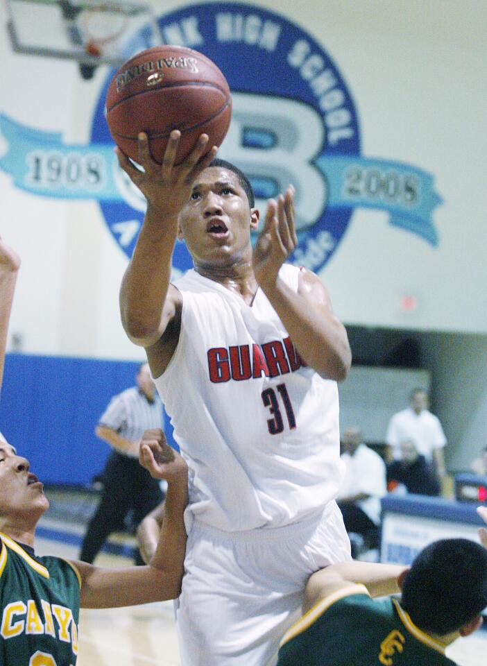 Bell-Jeff's Abid Oses finger rolls a shot to make the basket but is called for an offensive foul in the first quarter against Canyon in a non-league boys basketball game in the first round of the Burbank Tournament at Burbank High School on Tuesday, November 27, 2012. Casellas has sold trees in Burbank for 75 years.