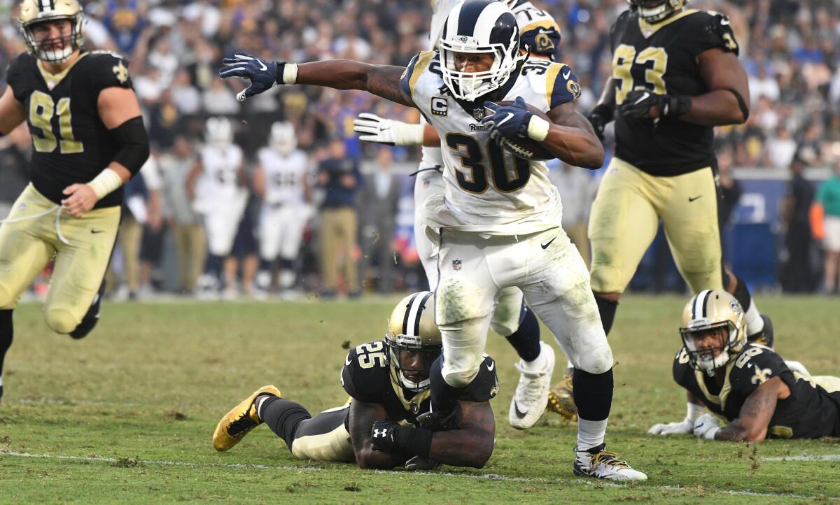 Todd Gurley of the Rams picks up yards against the New Orleans Saints in the fourth quarter.