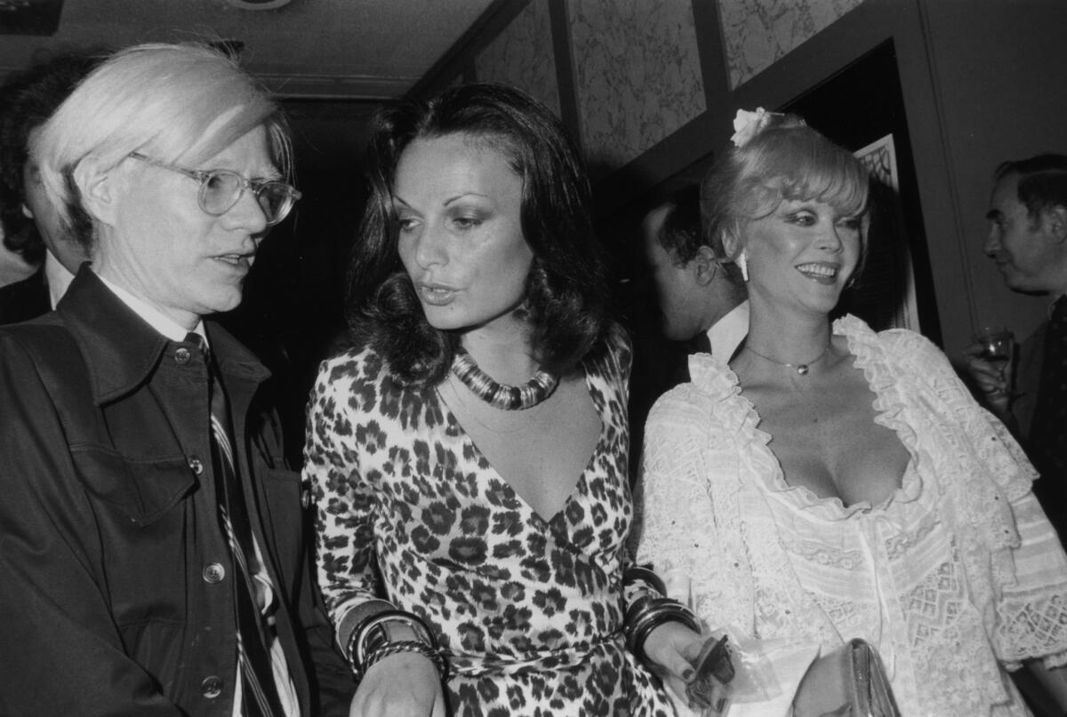 Andy Warhol, left, Diane von Furstenberg, and Monique Van Vooren.