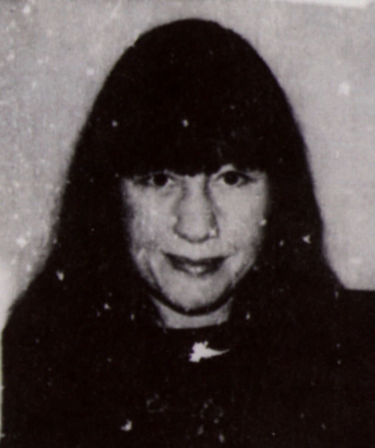 A black and white driver's license photo of Susan Berman