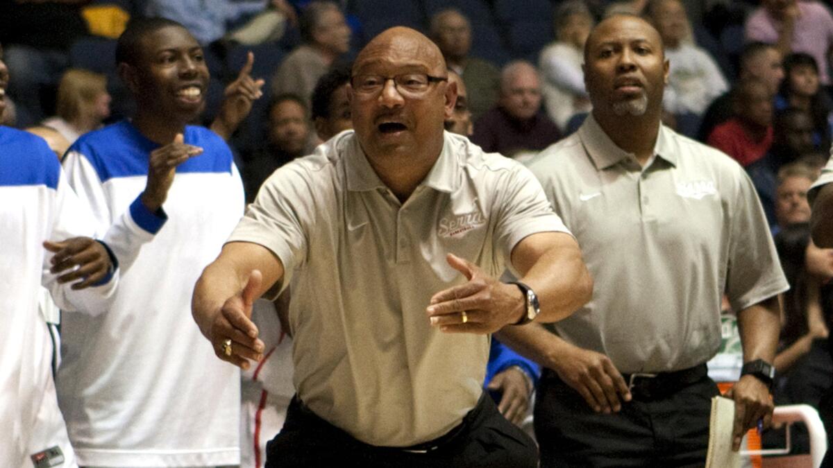 Serra Coach Dwan Hurt asks an official for a timeout during a 69-59 victory over La Verne Luthern in the 2012 Southern Section Division IV boys' basketball championship game.