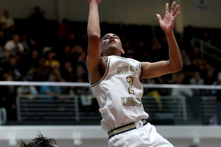 St. Francis player Andre Henry takes the charge and scores in the CIF SS Div. 2AA Basketball Finals vs. Santa Clarita Christian, at Azusa Pacific University in Azusa on Saturday, Feb.29, 2020. SFHS came up short 61-39.