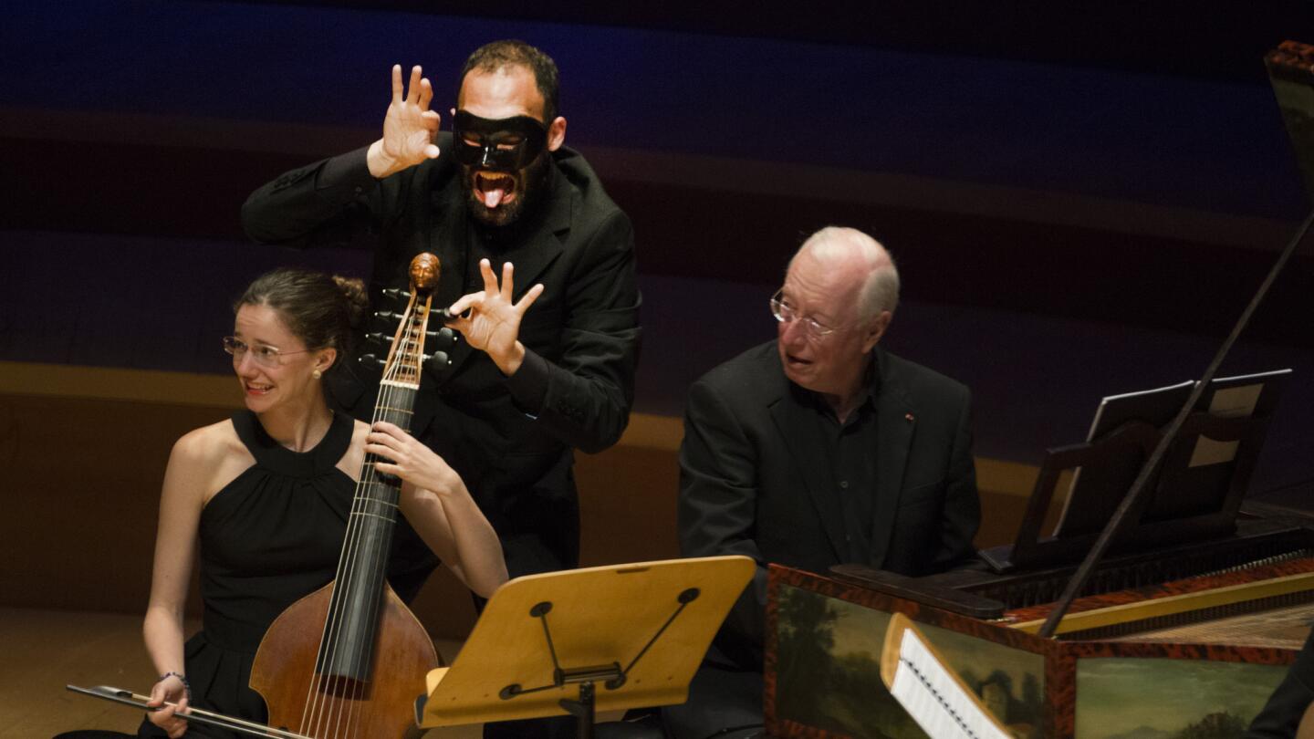 Myriam Rignol seems unaware of the mischief by Lisandro Abadie as William Christie looks on during Les Arts Florissants' performance at Walt Disney Concert Hall on May 6.