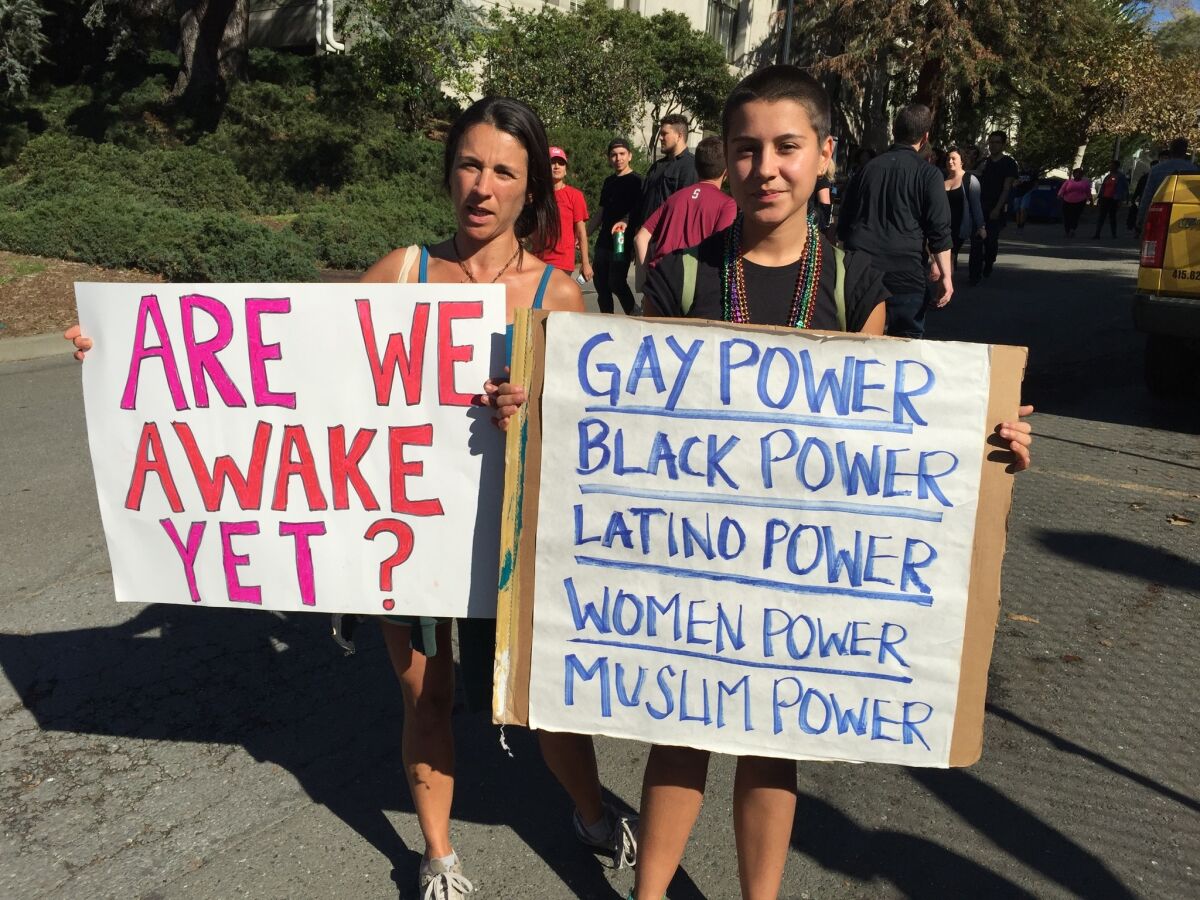 Berkeley residents Cristina Levert, and her daughter Soha, 17, spent Wednesday morning on the UC Berkeley campus protesting the election of Donald Trump as president.