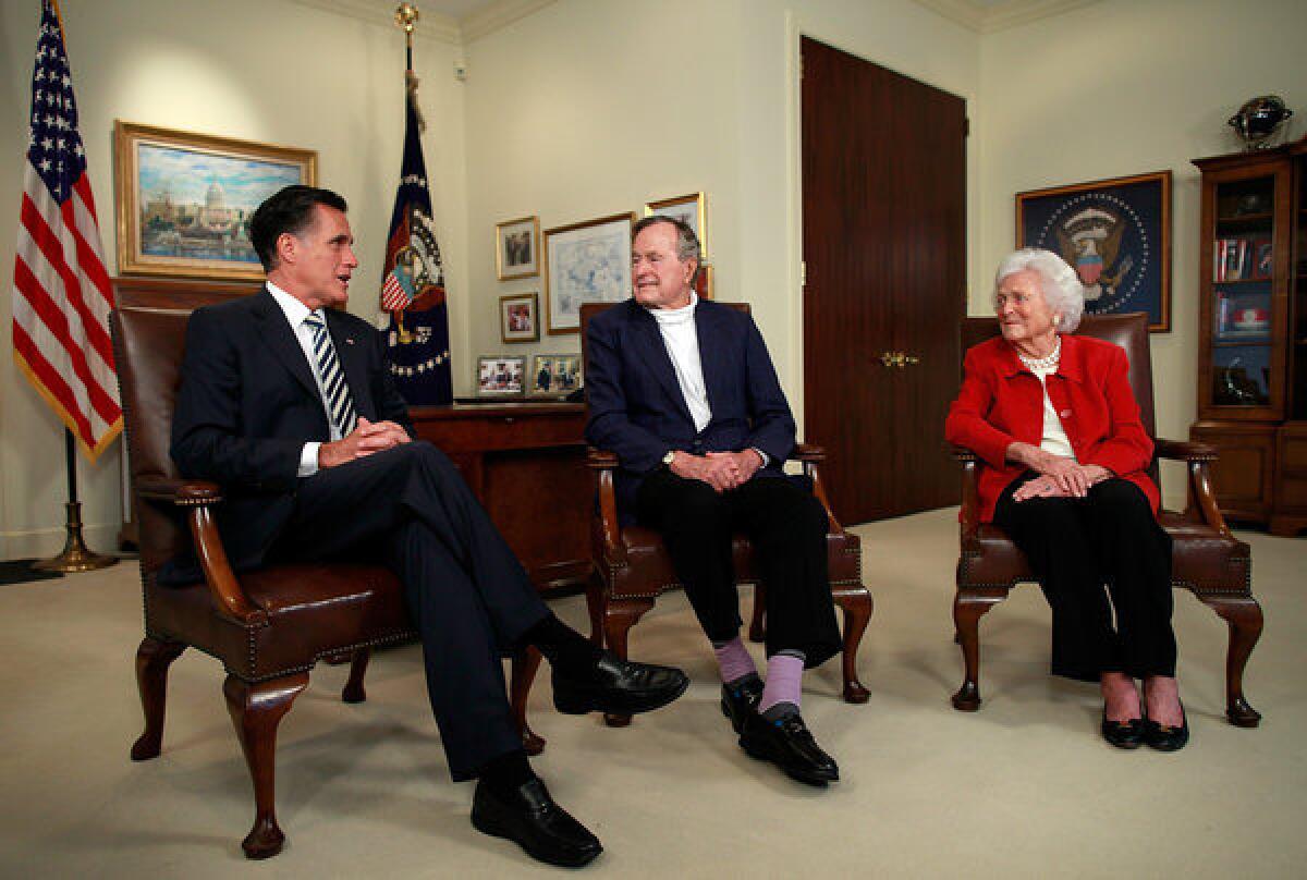 Mitt Romney meets with President George H.W. Bush and Barbara Bush at Bush's office on in Houston, Texas.