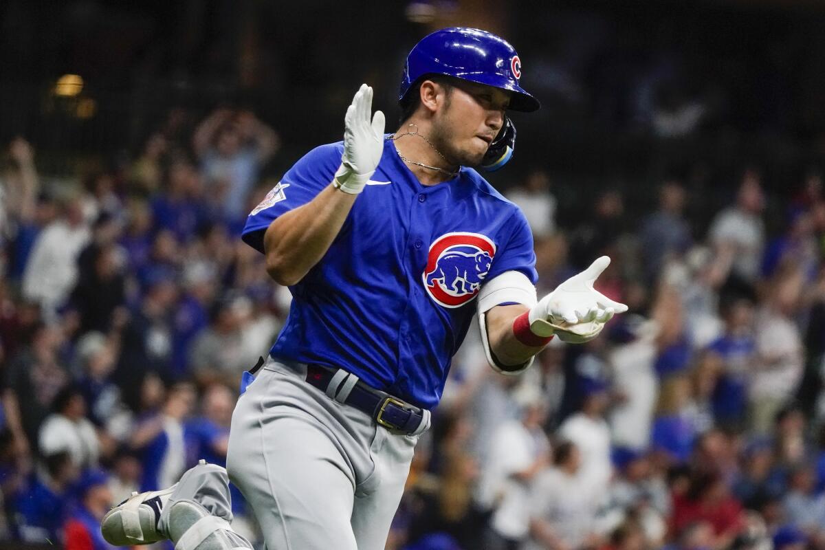 Chicago Cubs' Seiya Suzuki reacts after hitting a two-run home run during the fifth inning of a baseball game against the Milwaukee Brewers Tuesday, July 5, 2022, in Milwaukee. (AP Photo/Morry Gash)