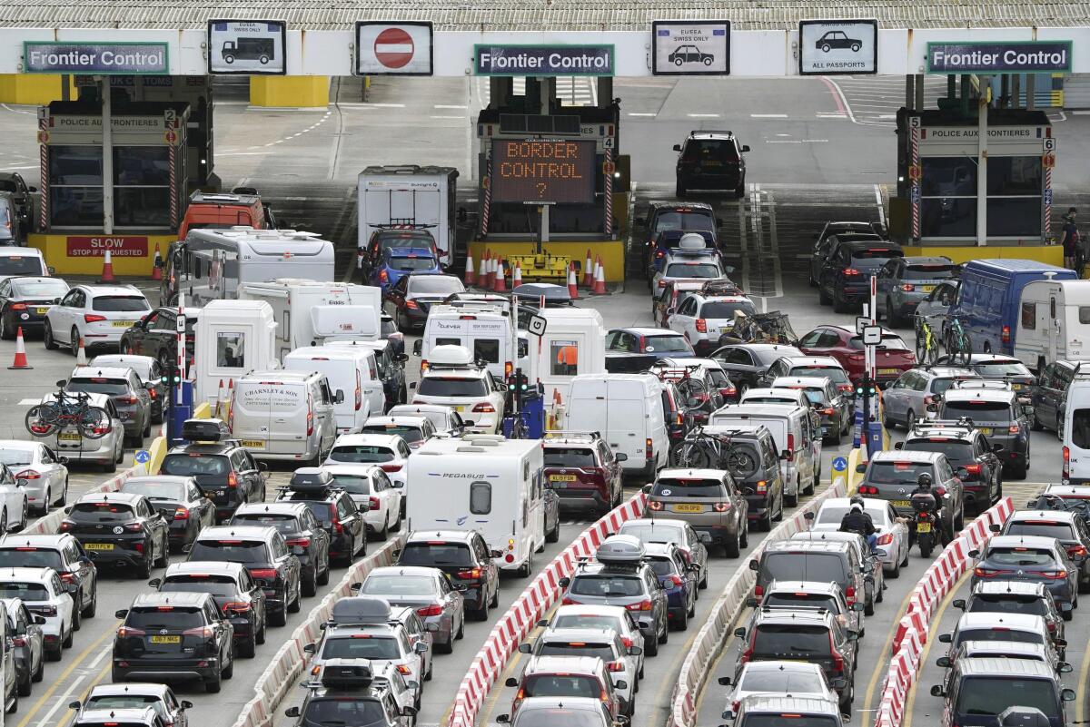 Car queue at the check-in at Dover Port as many families embark on getaways at the start of summer holidays for many schools in England and Wales, in Kent, England, Friday July 22, 2022. (Gareth Fuller/PA via AP)