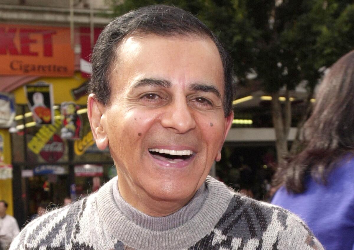 The body of the late Casey Kasem, shown here at a movie premiere in 2000, is no longer at a Tacoma, Wash., funeral home despite a court order saying it could not be moved or cremated pending a decision regarding an autopsy.