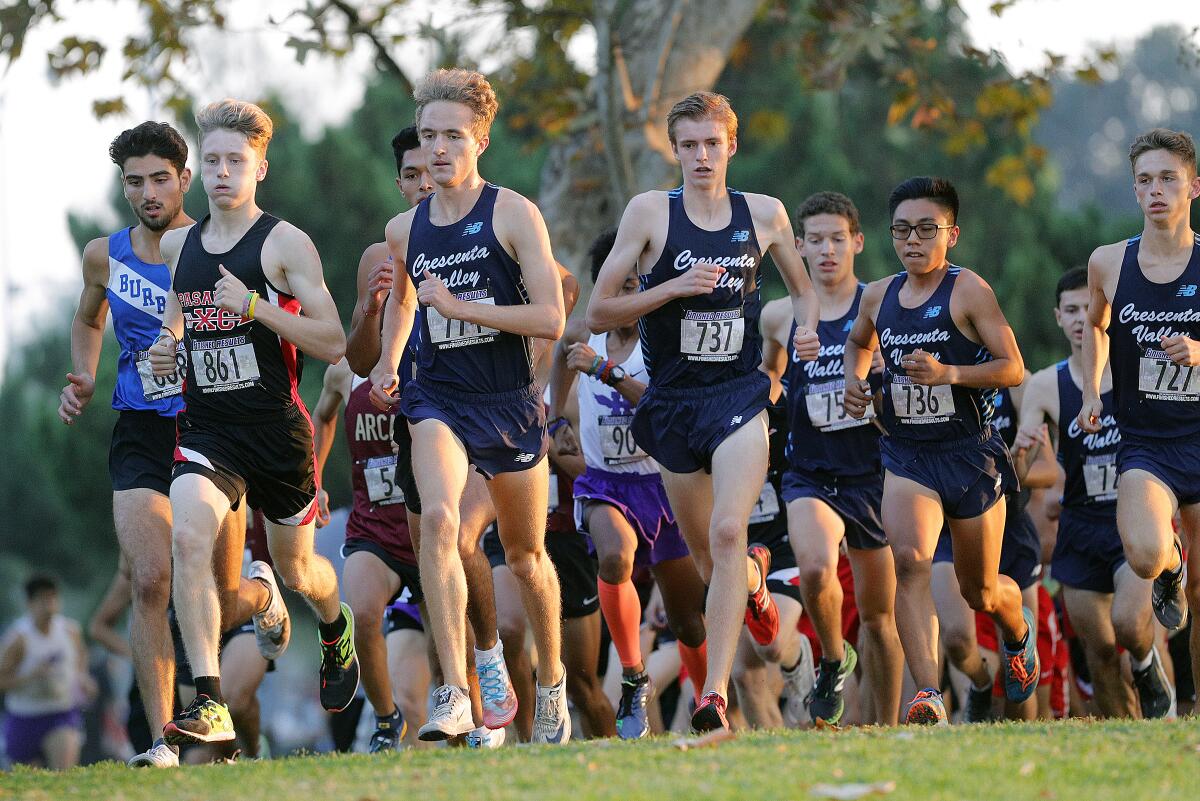 The Crescenta Valley High boys' team and Dylan Wilbur, third from left, take off at the start of Thursday's Pacific League finals at Arcadia Park.