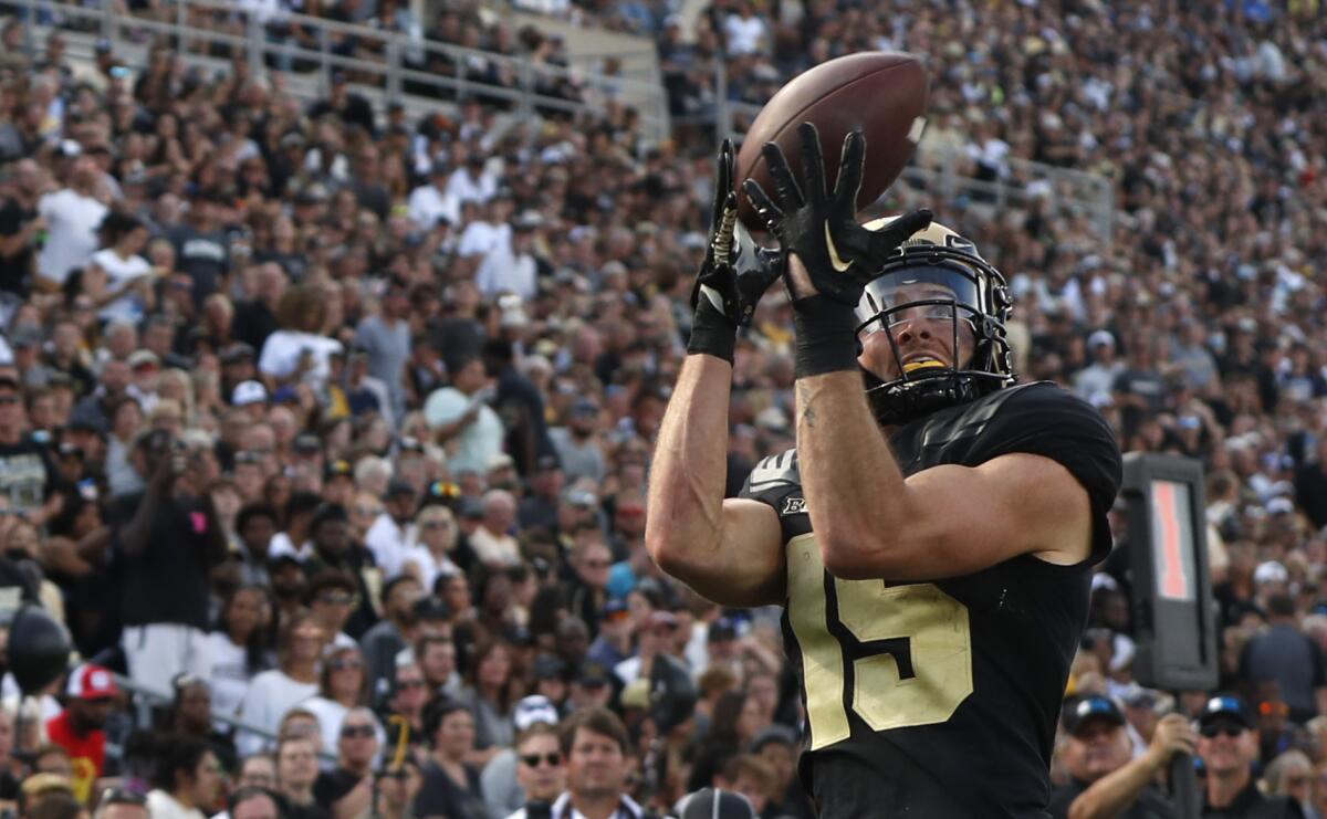 Purdue wide receiver Charlie Jones (15) catches a pass for a touchdown during an NCAA college football game against Indiana State, Saturday, Sept. 10, 2022, in West Lafayette, Ind. (Alex Martin/Journal & Courier via AP)