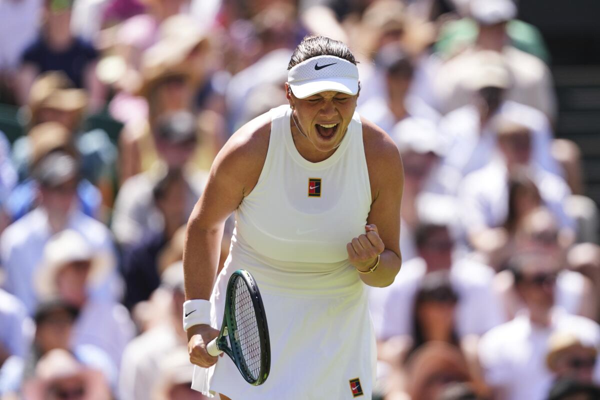 Amanda Anisimova reacts after winning a point against top-ranked Aryna Sabalenka.