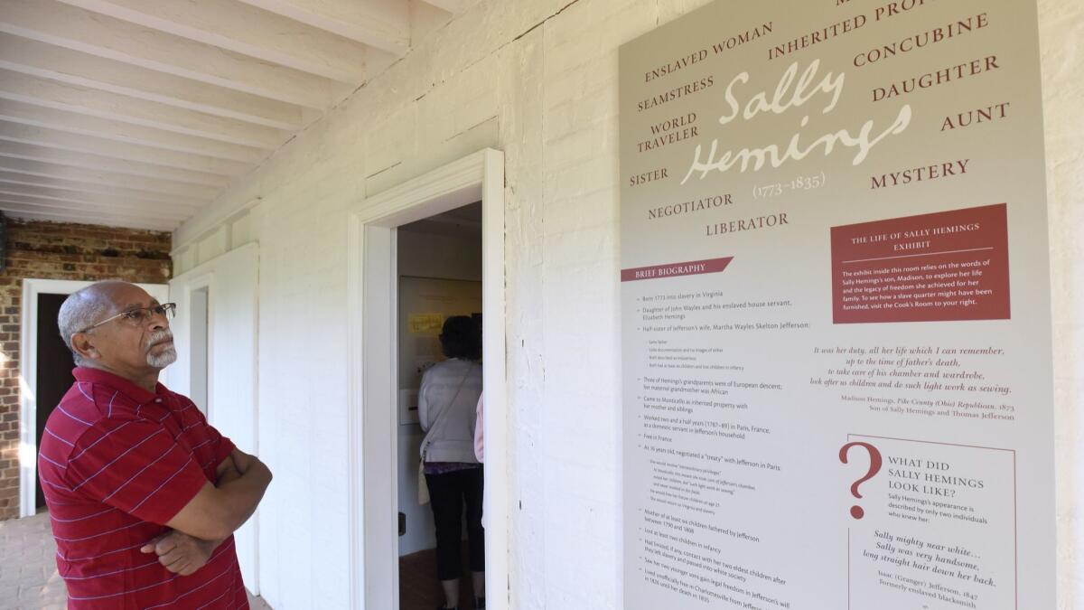 A man reads a plaque about Sally Hemings at Monticello, Thomas Jefferson's estate in Charlottesville, Va., on Saturday, June 16, 2018.