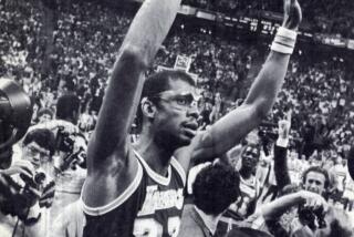 Kareem Abdul-Jabbar rejoices after passing Wilt Chamberlain in 1984 for the most points in a career with 31,149.