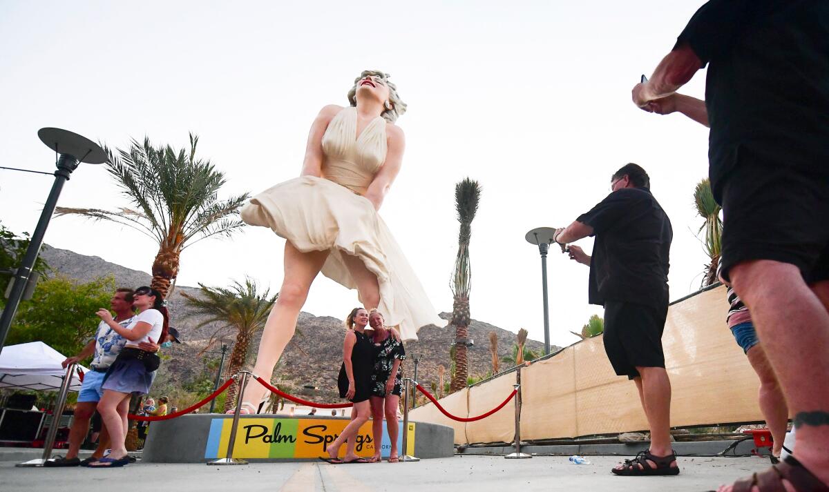 People visit the Forever Marilyn in Palm Springs.