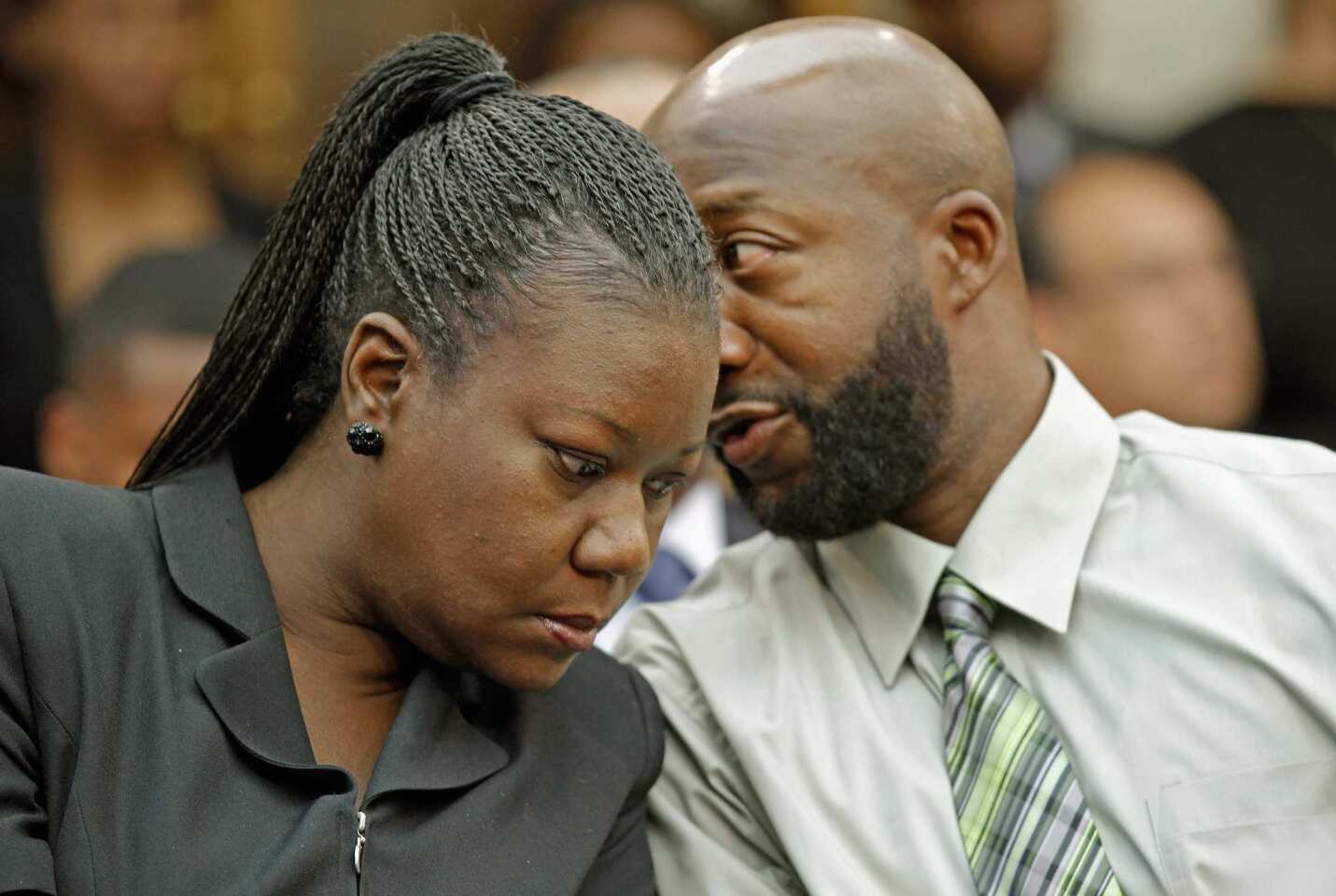 Sybrina Fulton and Tracy Martin, Trayvon Martin's parents, attend a House briefing in Washington on March 27. Tracy Martin called for supporters to continue working to make sure his son "did not die in vain."