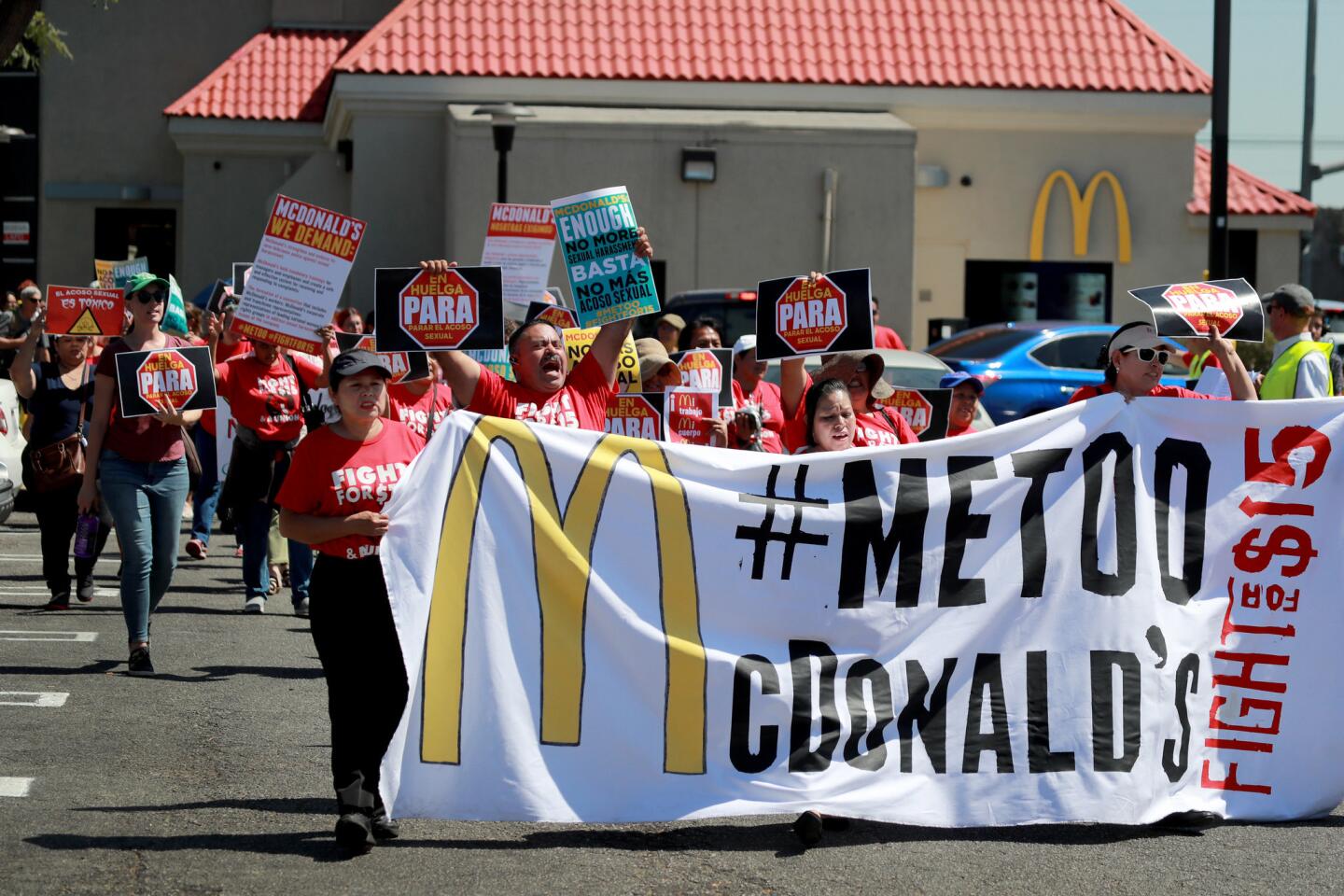 McDonald's workers, women's groups and civil rights groups stage a lunchtime strike at a South Los Angeles McDonald's to spotlight alleged sexual harassment throughout the fast-food giant's organizational culture as part of a 10-city protest.