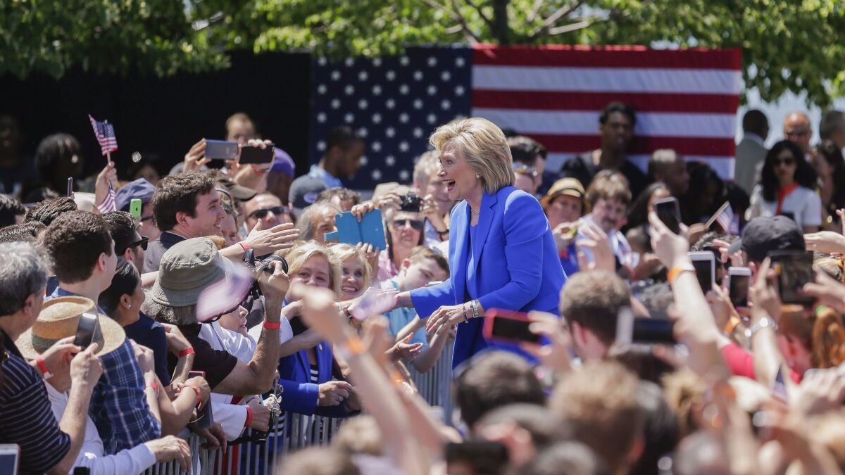 Hillary Clinton arrives at a rally billed as the official launch of her presidential campaign, held on New York's Roosevelt Island on June 13, 2015.