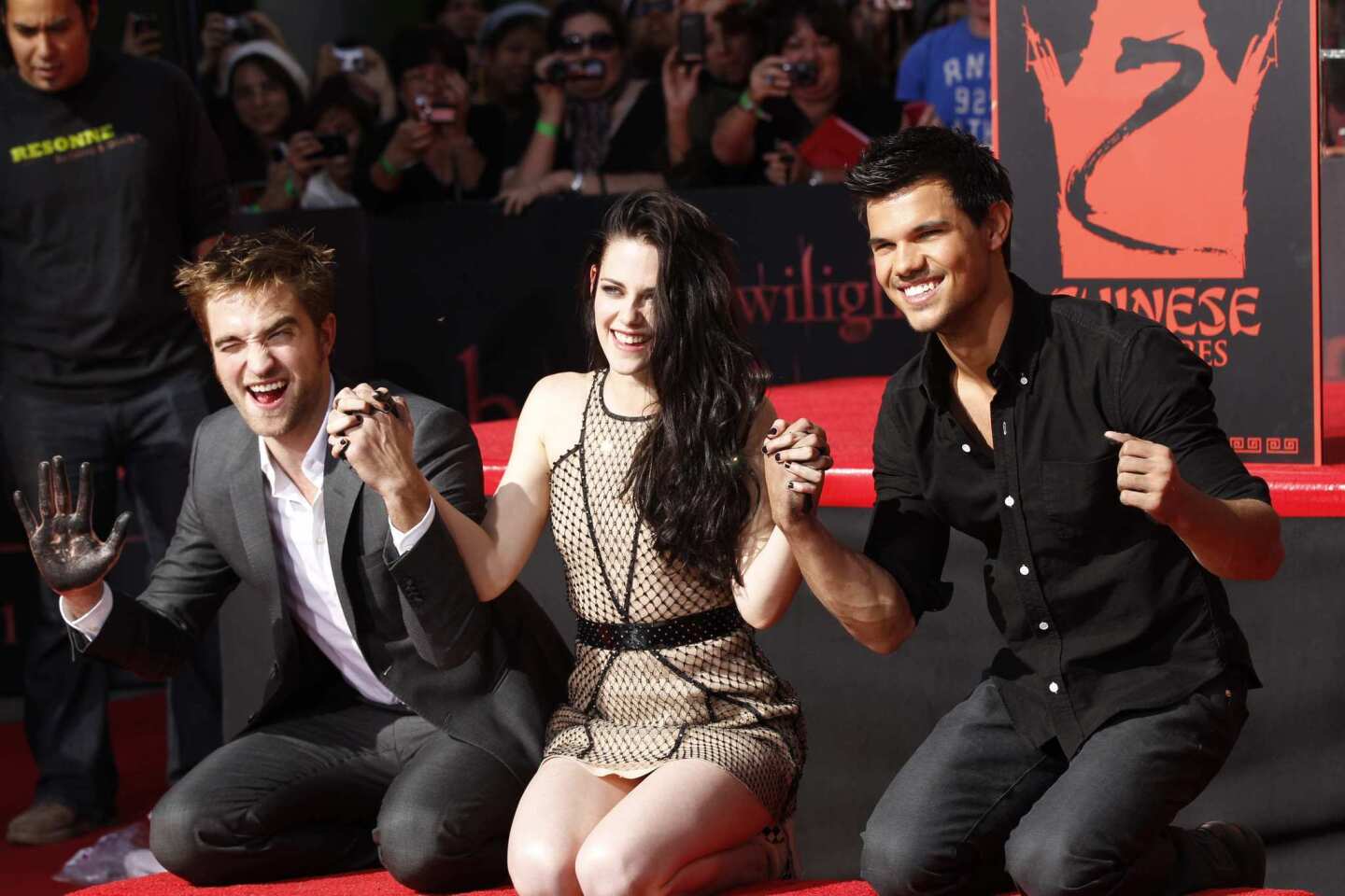 The stars of "The Twilight Saga" -- Robert Pattinson, left, Kristen Stewart and Taylor Lautner-- received one of Hollywood's top honors on Thursday: their handprints and footprints immortalized in cement outside Grauman's Chinese Theater.