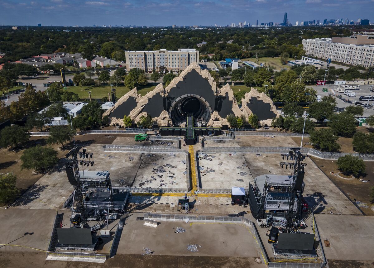 The Astroworld main stage where Travis Scott was performing Friday evening where a surging crowd killed eight people, sits full of debris from the concert, in a parking lot at NRG Center on Monday, Nov. 8, 2021, in Houston. ( Mark Mulligan/Houston Chronicle via AP)