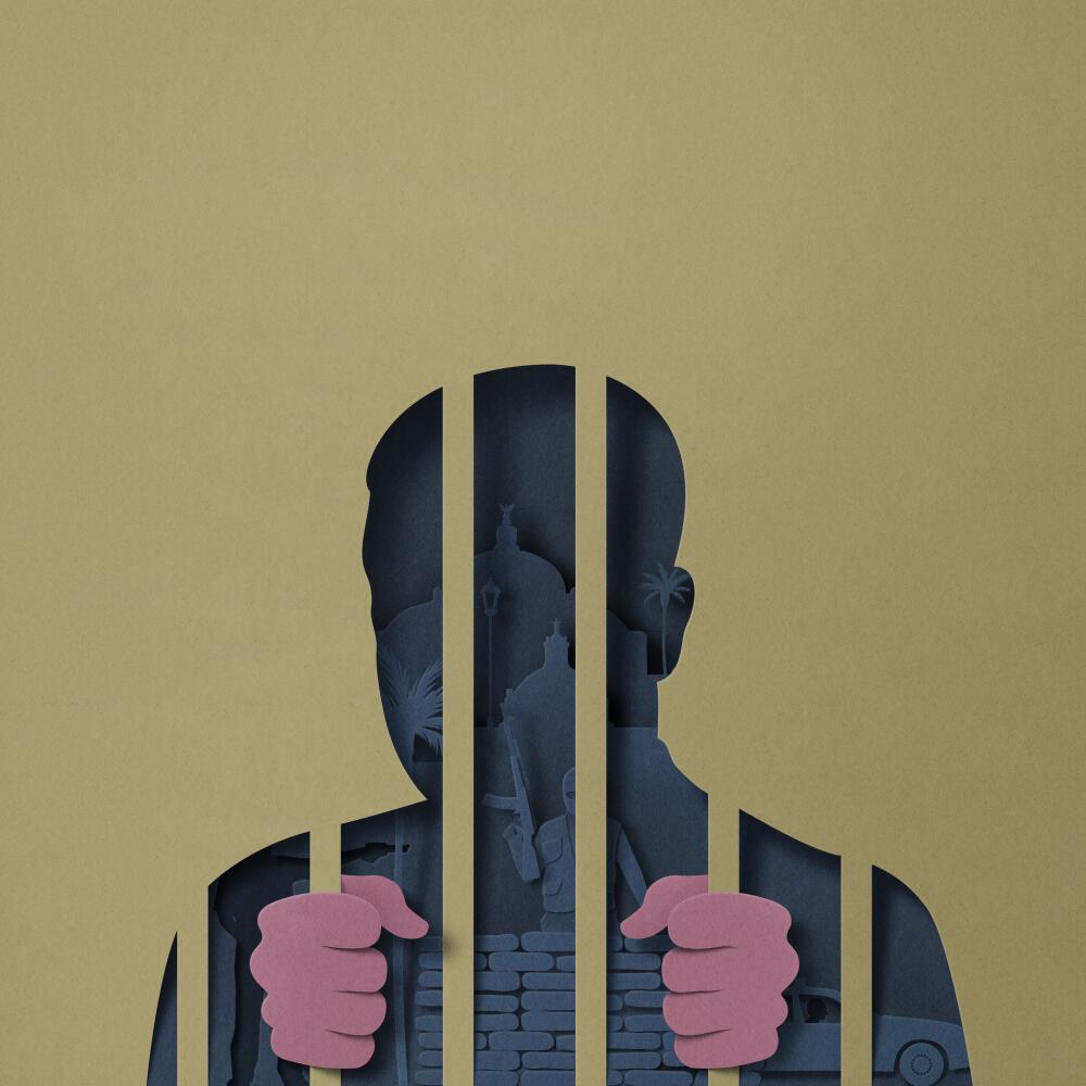 Silhouette of a man behind bars.